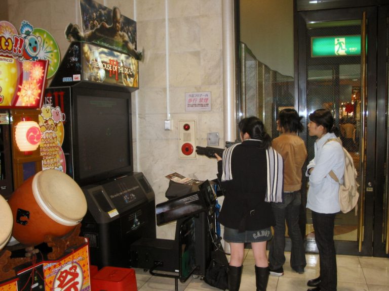 Discover the Best Free Online Games for Everyday Entertainment Young women playing video games at an arcade in Japan